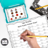 ugly sweater logic puzzles in a task card box with a worksheet and hand holding a pencil